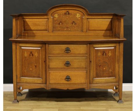 An Arts &amp; Crafts oak and marquetry side cabinet, three-quarter gallery inlaid in the Art Nouveau taste with flowerheads a
