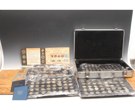 Numismatics –  An aluminium photographer’s carrying case containing five trays of coins, including First UK decimal set; Jama
