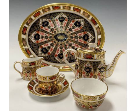 Royal Crown Derby 1128 Imari pattern miniature cabaret tea set comprising teapot, teacup and saucer, cream jug, sucrier and s
