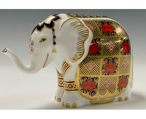 A Royal Crown Derby paperweight, Imari Elephant, trunk raised, printed in the 1128 palette, gold stopper, 10cm high 