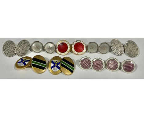A pair of George V silver and engine turned enamel cuff links, Birmingham 1911, 7g; a pair of silver oval cuff links engraved
