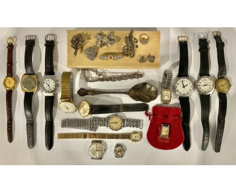 An assortment of silver plated and silver coloured jewellery including brooches, rings, bracelets, a silver plated spoon, etc