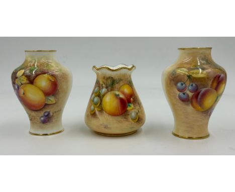 Two Royal Worcester half painted baluster vases decorated with fruit on mossy background 11cm one signed G. Banks with black 