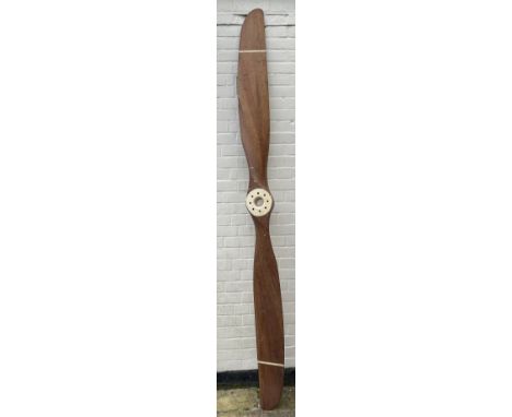 An early 20thC Avro 504 80HP mahogany two-blade propeller with metal centre to the hub stamped 'AVRO Y80 80HP GNOME TYPE 504 