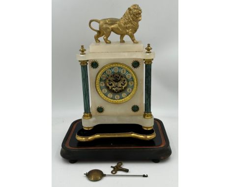 A late 19thC eight day French mantle clock, alabaster and gilt with Arabic numerals, green dial, black and green pillars and 