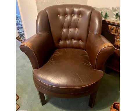 A button backed brown leather covered armchair, by repute belonging to Robert Blackburn of Blackburn's Aircraft Factory. 91 h