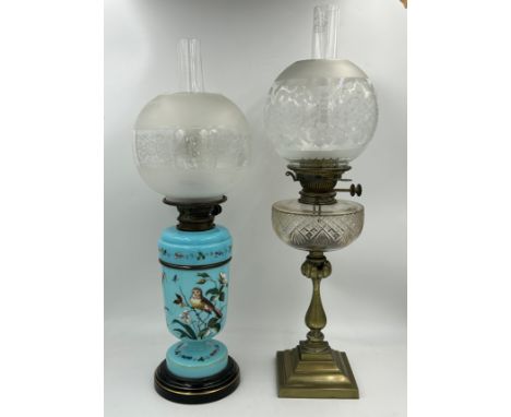 A Hinks &amp; Son Victorian two section oil lamp with blue opaline body painted with birds and flowers with an etched globe s