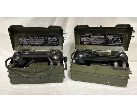 A pair of British Army Field Telephones Set J/ YA7815 in green metal cases, instructions for use printed on the inside lid, s
