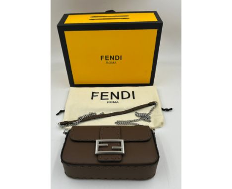 A genuine Fendi Baguette mini leather bag comes with dust bag and box. 22 x 13 x 6cm.