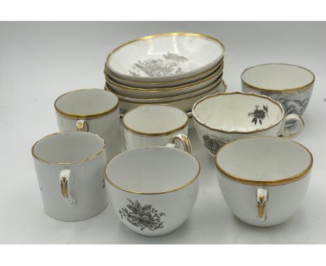 A group of early 19th century bat printed cups and saucers, c. 1820. To include landscape scenes and flowers. Saucers: 14cm w