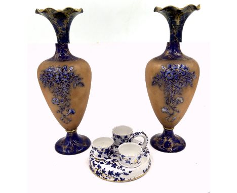 A pair of 19thC ceramic vases with gilt edged floral design in cobalt blue and brown 29cm, indistinct mark with Rd.No 201360 