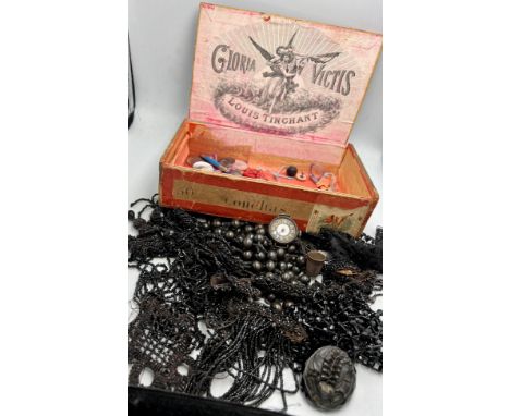 A cigar box and contents to include jet brooch, french jet beadwork dress trimmings, 925 silver watch lacking glass etc.