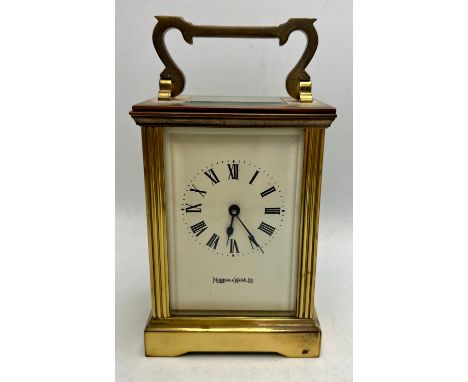 Mappin &amp; Webb Ltd brass carriage clock with key. 11cm h.