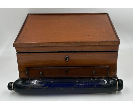 A Victorian blue glass rolling pin measuring 41cm, together with a mahogany writing slope with a small front drawer and insid