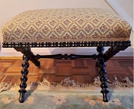 A 19thC upholstered stool on bobbin turned legs. 44cm h x 55cm w x 45cm, d.