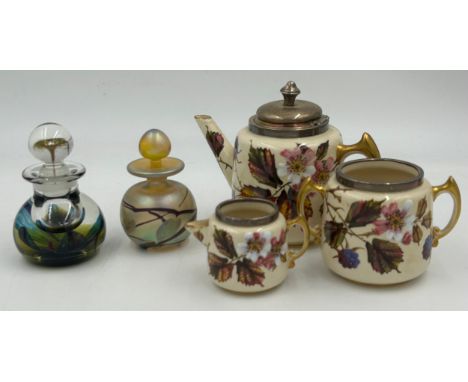 A Taylor Tunniciffe &amp; Co ceramic teapot, sugar bowl and milk jug in floral design with silver rims marked Birmingham 1922