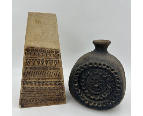 Mid century studio pottery to include a coffin shaped vase in brown hues 29cm high marked 59 JW and a textured lamp base with