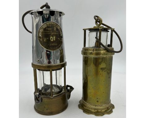 An Eccles Type 6 miners safety lamp by the Protector Lamp and Lighting Co. Ltd. No 01 together with a brass lamp inscribed to