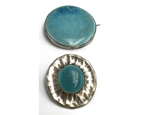 An Art &amp; Crafts Ruskin pottery brooch with sterling silver surround, 5cm d together with a Ruskin Guild button/brooch, de