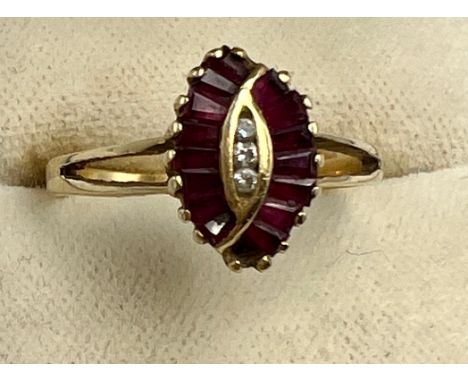 A ruby and cubic zirconia ring set in 14 carat yellow gold. Size N. Weight 1.9gm.