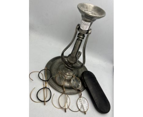 Pewter gimble mounted candlestick together with three yellow metal framed spectacles and one spectacle case.