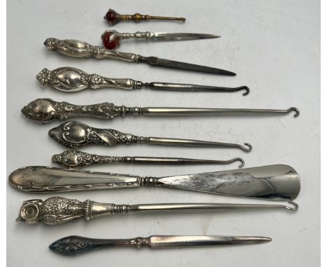 Ten various silver and brass handled button hooks, shoehorn, nail file etc to include owl button hook, Birmingham 1907, maker