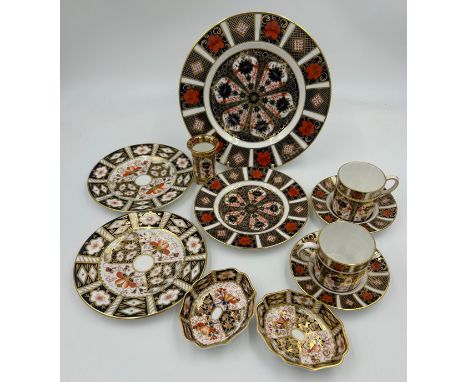 Royal Crown Derby. Old Imari 1128 pattern to include 1 x  plate 22cm, 2 x coffee cans and saucers, 1 x  plate 16cm and a foot
