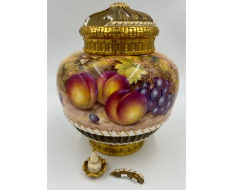 A large Royal Worcester potpourri jar decorated with peaches and grapes on a moss background signed Freeman with makers mark 