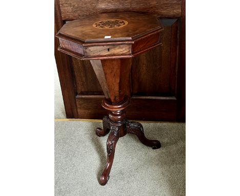 A 19thC walnut work table with tripod base. 72cm h.