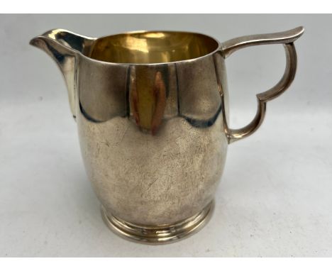 Silver jug London 2010, maker WW.  Height 9cm. Weight 256gm.