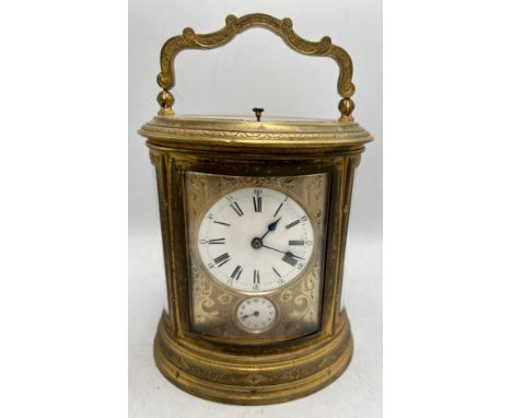 A 19thC brass repeater carriage clock with French movement and alarm. 19cm h to top of handle.