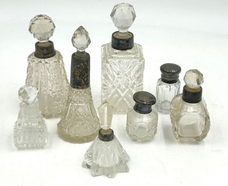 A collection of 5 silver topped/collared scent bottles and 3 others. Tallest 14.5cm. Most a/f.