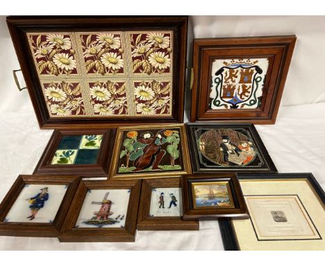 Makkum hand painted tiles depicting a picture of a windmill, stilt walkers and a sweet seller. Two Maw &amp; Co tiles of a mu