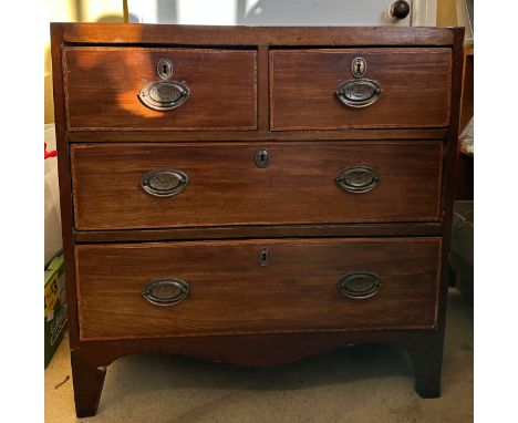 An early 19thC mahogany caddy top chest of drawers with two short and two long drawers. 76 w x 45 d x 77cm h.