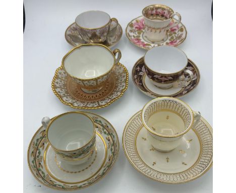 A group of early 19th century hand-painted porcelain cups and saucers, c. 1820. Saucers: 14cm wide. (6)Condition: some minor 