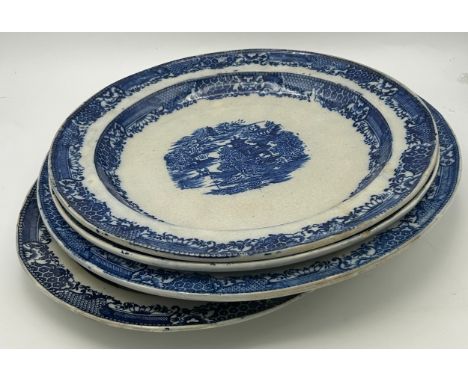 A group of early 19th century blue and white transfer printed chargers and similar platter, c. 1800. To include Conversation 