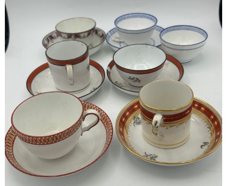A group of early 19th century hand-painted porcelain cups and saucers with gilding, painted and bat printed decoration, c. 18