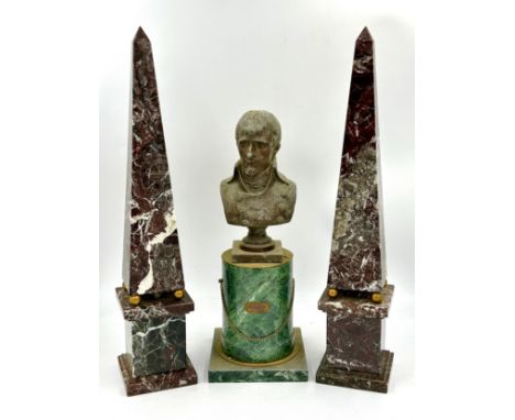 A metal bust of Napoleon on a marble pedestal 40cm high. Together with a pair of decorative marble obelisk 52cm high (3).