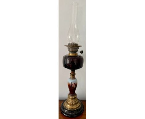 Brass and ceramic oil lamp with silver mounts. 46cm h.