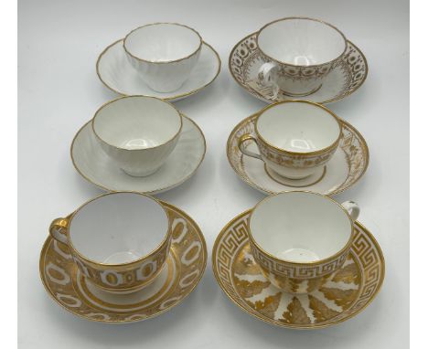 A group of early 19th century hand-painted porcelain cups and saucers with gilding, c. 1820. Saucers: 14cm wide. (6)Condition