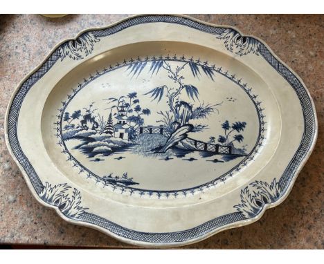 An early 19th century hand-painted pearlware landscape pattern moulded rim platter, c. 1810. 48cm wide. (1)Condition: some we