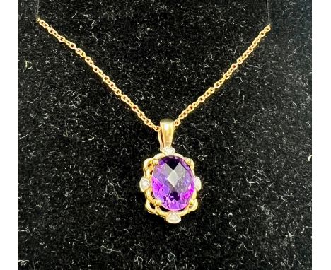 A 9 carat gold amethyst and diamond set pendant on a nine carat gold chain. Total weight 2.9gm.