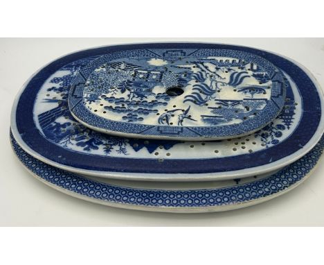 A group of three early 19th century blue and white transfer printed drainers, c. 1800. To include Willow, Buddleia and Dagger