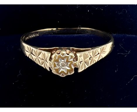 A 9 carat gold diamond set ring. Size R. Weight 1.4gm.