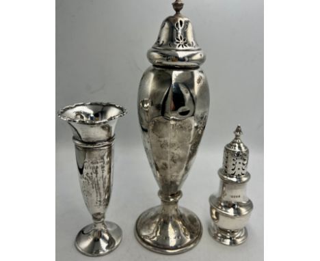Hallmarked silver to include vase, Victorian pepper pot and sugar shaker, various dates and makers. Total weight 237gm.