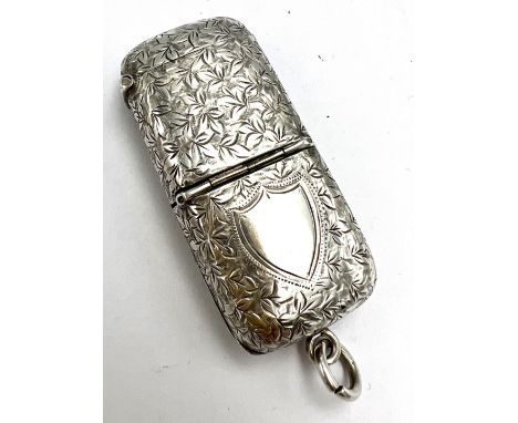 A hallmarked silver novelty compendium comprising vesta case, cheroot cutter, stamp holder and picture frame with suspension 