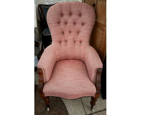 A 19thC well upholstered armchair with button back. Ht to seat 42cm, Ht to back 105cm.