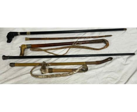 A collection of wooden Walking Sticks, Canes and Riding Crops including one silver topped and two bone handled. Longest 92cm.