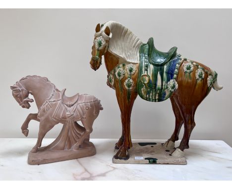 Two 20thC ceramic Tang horses. The larger coloured glazed horse with large chip to base, 63cm h x 59cm l.