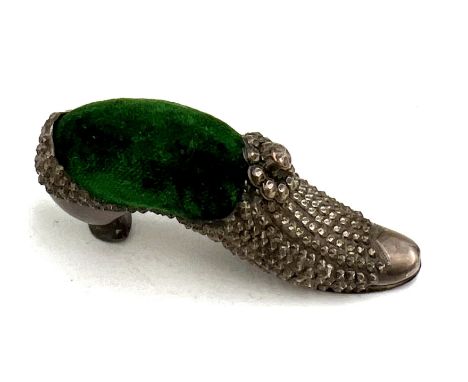 An Edwardian novelty pincushion in the form of a shoe. 7cm l. Birmingham 1902, maker Adie &amp; Lovekin Ltd.